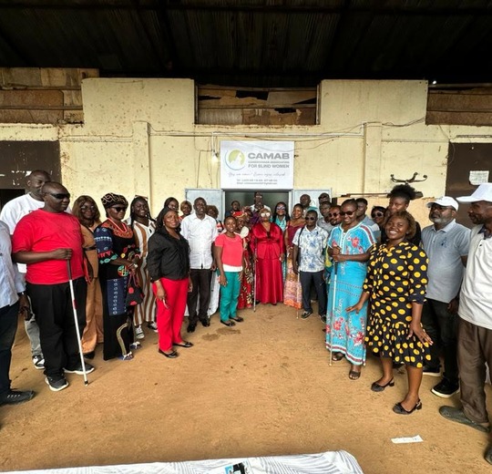 A crowd gathered outside the building at the opening of the CAMAB Centre, Nkolbisson.