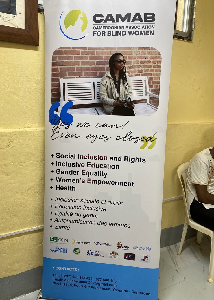 The CAMAB Women banner at the Centre, reading Yes we can. Even eyes closed, and listing social inclusion and rights, inclusive education, gender equality, women empowerment and health.
