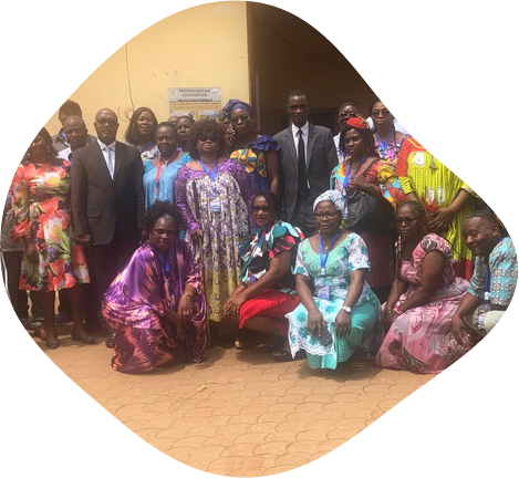 Members of CAMAB Women gathered outside for a group photograph, several white canes visible.