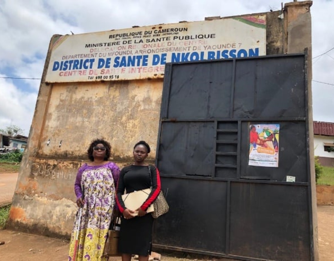 Two CAMAB Women representatives at the gate of the Nkolbisson health district, Ministry of Public Health.